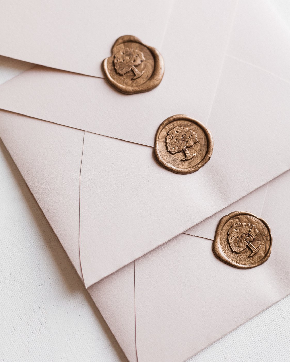 White Envelopes Arranged by Wax Seals in Row